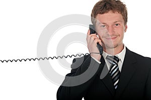 Businessman holding a telephone handset