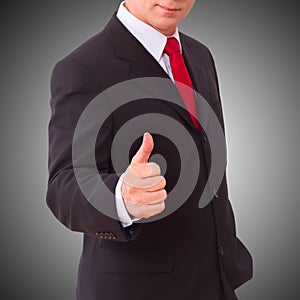 Businessman holding thumbs up