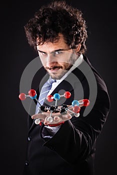 Businessman holding tnt molecular structure