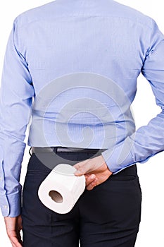 Businessman holding toilet paper behind his back.