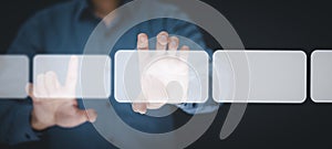 Businessman holding touch screen interface on the black background,graph Screen Icon of media screen, Technology Process System