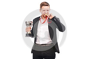 Businessman holding trophy