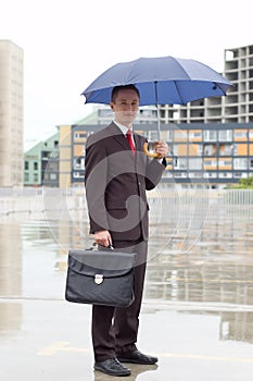 Businessman Holding an Umbrella
