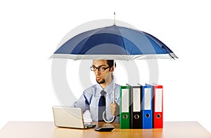 Businessman holding umbrella