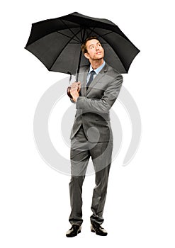 Businessman holding umbrella smiling isolated white background