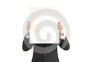 Businessman holding up blank poster