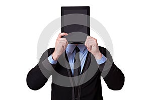 Businessman holding up a tablet pc in front of his face