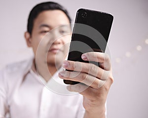 Businessman Holding and Using Smart Phone
