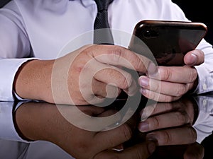 Businessman Holding and Using Smart Phone