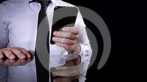 Businessman Holding and Using Smart Phone