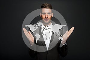 Businessman holding virtual world map