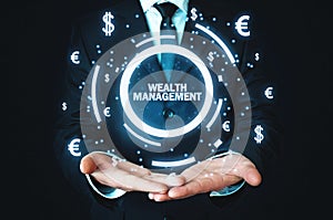 Businessman holding Wealth Management word with currency symbols