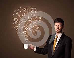 Businessman holding a white cup with social media icons