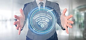 Businessman holding Wifi icon with stats and binary code 3d rendering