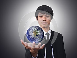 Businessman holding world (Earth view image from h photo