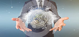 Businessman holding a World globe surronding by ecology icons and connection 3d rendering