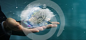 Businessman holding a World globe surronding by ecology icons an photo