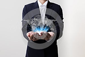 Businessman holding worldwide network symbols