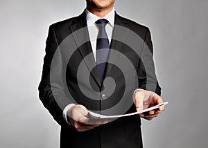 Businessman holds a booklet