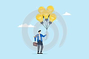 Businessman holds bright lightbulb idea balloons, illustrating innovation, creativity, and smart thinking