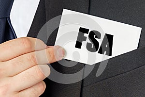 Businessman holds a card with the text - FSA