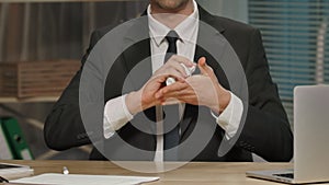 Businessman holds contract in her hands, then breaking and squeeze his. Man in black business suit sits at table in