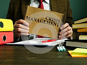 Businessman holds Crisis Management plan