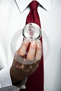 Businessman holds Earth in a hand