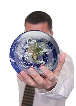 Businessman holds globe featuring America
