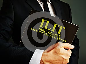 Man holds Irrevocable Life Insurance Trust ILIT policy photo