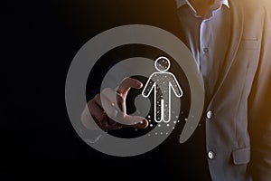 Businessman holds man person icon on dark tone background.HR Human ,people iconTechnology Process System Business with Recruitment