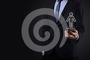 Businessman holds man person icon on dark tone background.HR Human ,people iconTechnology Process System Business with Recruitment