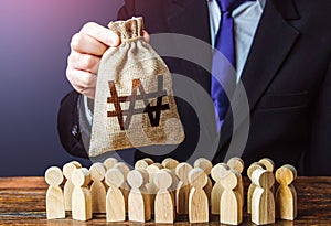 Businessman holds out a south korean won money bag to the crowd. Providing money, paying salaries and grants. Staff maintenance.