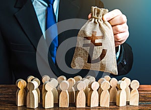 Businessman holds out a turkish lira money bag to the crowd. Compensation payments. Providing money, paying salaries and grants.