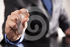 Businessman Holds Penny photo