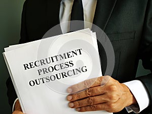 Man holds Recruitment Process Outsourcing RPO