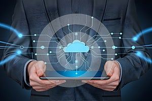 Businessman presents cloud computing technology on a tablet showcasing data connections and digital network
