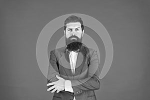 Businessman or host fashionable outfit red background. Formal outfit. Confident posture. Man bearded hipster wear