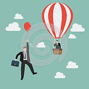 Businessman in hot air balloon fly pass businessman with red balloon