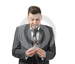 Businessman with hourglass on white background. Time management concept