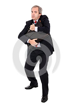 Businessman hugging briefcase