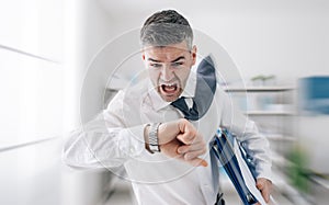 Businessman in a hurry checking time