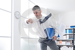 Businessman in a hurry checking time