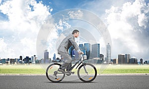 Businessman hurry to work by bike