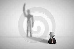 Businessman icon standing on gray floor and shadow shading on wall in human shape.