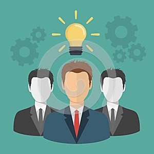 Businessman with an idea concept. Man standing next to light bulb as symbol of great business idea. Teamwork and brainstorming