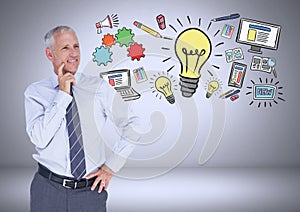 Businessman with ideas and computer graphic drawings