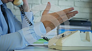 Businessman Image in Office Room Using an Old Telephone and Gesticulate