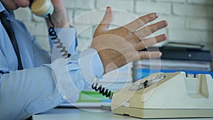 Businessman Image in Office Room Using an Old Telephone and Gesticulate