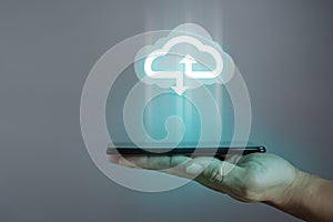 Businessman or information technologist with cloud computing icon and tablet